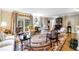 Elegant living room with hardwood floors, ornate area rug, fireplace, and French doors leading to a patio at 3456 Paces Nw Pl, Atlanta, GA 30327