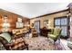 Comfortable living room featuring paneled walls, wood shutters, and a variety of seating arrangements at 3456 Paces Nw Pl, Atlanta, GA 30327
