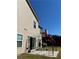 Home exterior featuring outdoor grilling area on patio with backyard views at 457 Panhandle Pl, Hampton, GA 30228