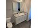 Bathroom featuring a granite countertop and white cabinets and a mirror at 457 Panhandle Pl, Hampton, GA 30228