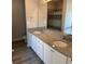 Elegant bathroom with double sinks, granite countertops, and a large mirror, offering a spa-like experience at 457 Panhandle Pl, Hampton, GA 30228