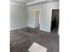 A carpeted bedroom with doors to a bathroom and closet space; a peaceful retreat at 457 Panhandle Pl, Hampton, GA 30228