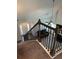 A view from the top of the stairs shows the foyer, living room, and front door at 457 Panhandle Pl, Hampton, GA 30228