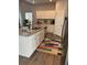 This kitchen features granite countertops, stainless steel appliances, and white cabinets at 457 Panhandle Pl, Hampton, GA 30228