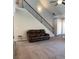Cozy living room with carpet, adjacent to staircase, neutral paint, and natural light at 457 Panhandle Pl, Hampton, GA 30228