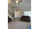 Bright living room with high ceilings, carpet, and abundant natural light at 457 Panhandle Pl, Hampton, GA 30228