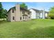 Expansive backyard featuring lush lawn and mature trees, perfect for outdoor activities and relaxation at 237 River Pass Ct, Dacula, GA 30019