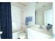 Full bathroom with shower/tub combo, white vanity, toilet, and tile flooring at 237 River Pass Ct, Dacula, GA 30019