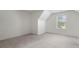 Bedroom features neutral carpet, vaulted ceiling, and one window providing natural light at 237 River Pass Ct, Dacula, GA 30019