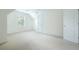 Spacious bedroom with neutral carpet, window, closet, and white trim at 237 River Pass Ct, Dacula, GA 30019