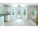 Sunny breakfast area with tiled flooring, plenty of natural light, and views of the backyard at 237 River Pass Ct, Dacula, GA 30019