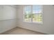 Bright walk-in closet featuring wire shelves and a window for natural light at 237 River Pass Ct, Dacula, GA 30019