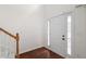 Entryway features hardwood flooring and a white front door with sidelights at 237 River Pass Ct, Dacula, GA 30019