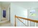 Bright upstairs hallway with natural light and views of the front entry at 237 River Pass Ct, Dacula, GA 30019