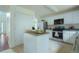 Well-equipped kitchen featuring white cabinets, stainless steel appliances, and ample counter space at 237 River Pass Ct, Dacula, GA 30019