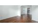 Open living space with hardwood floors, wainscoting, and seamless flow to the dining and kitchen areas at 237 River Pass Ct, Dacula, GA 30019