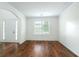 Inviting living room featuring hardwood floors, bright windows, and neutral wall color at 237 River Pass Ct, Dacula, GA 30019