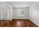 Spacious living room boasts hardwood floors, crown molding, and natural light at 237 River Pass Ct, Dacula, GA 30019