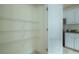 Spacious pantry with wire shelving and easy access to the kitchen appliances at 237 River Pass Ct, Dacula, GA 30019
