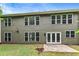 Back exterior of home featuring a concrete patio and a view of the grassy backyard at 3153 Daleview Sw Way, Atlanta, GA 30331