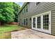 Back of home with patio and yard featuring double doors and several large windows at 3153 Daleview Sw Way, Atlanta, GA 30331