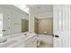 Bathroom features a double sink vanity, a bathtub and is decorated in neutral tones at 3153 Daleview Sw Way, Atlanta, GA 30331