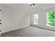 Neutral bedroom with carpet and paint with natural light from dual windows at 3153 Daleview Sw Way, Atlanta, GA 30331