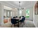 Dining room featuring modern lighting, crisp millwork, and a serene atmosphere at 3153 Daleview Sw Way, Atlanta, GA 30331