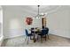Elegant dining area with modern chandelier and wainscoting for sophisticated dinners at 3153 Daleview Sw Way, Atlanta, GA 30331
