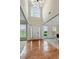 Bright, two-story foyer featuring hardwood floors and an elegant entry door at 3153 Daleview Sw Way, Atlanta, GA 30331