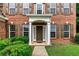 Close-up of a home's front door, showing brick facade and manicured bushes at 3153 Daleview Sw Way, Atlanta, GA 30331
