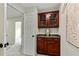Hallway with custom-built wood cabinet and granite counter at 3153 Daleview Sw Way, Atlanta, GA 30331