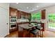 Kitchen featuring a central island with breakfast bar and stainless-steel appliances and cherry cabinets at 3153 Daleview Sw Way, Atlanta, GA 30331