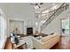 Spacious living room with high ceilings, a fireplace, and lots of natural light from large windows at 3153 Daleview Sw Way, Atlanta, GA 30331