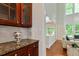Bright living room with vaulted ceiling and large windows overlooking the backyard at 3153 Daleview Sw Way, Atlanta, GA 30331