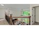 View of the living room from the loft featuring an open floor plan and large windows at 3153 Daleview Sw Way, Atlanta, GA 30331