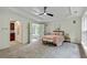 A spacious main bedroom boasts a trey ceiling, ceiling fan, and a peaceful sitting area at 3153 Daleview Sw Way, Atlanta, GA 30331