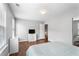 Bedroom with wood floors, a large window, and neutral colored walls at 411 Sugar Maple Ct, Canton, GA 30114