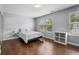 Cozy bedroom with wood floors and large windows for ample light at 411 Sugar Maple Ct, Canton, GA 30114
