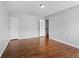 Spacious bedroom with wood floors and neutral walls at 411 Sugar Maple Ct, Canton, GA 30114