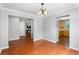Dining room with hardwood floors, access to multiple rooms, and ample natural light at 411 Sugar Maple Ct, Canton, GA 30114