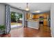 Eat-in kitchen featuring stainless steel appliances, tile backsplash, and sliding doors to the backyard at 411 Sugar Maple Ct, Canton, GA 30114