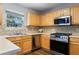Well-equipped kitchen with stainless steel appliances, gas range, and ample counter space at 411 Sugar Maple Ct, Canton, GA 30114