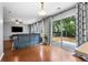 Open-concept living room with a sliding glass door leading to the backyard patio at 411 Sugar Maple Ct, Canton, GA 30114