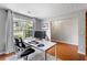 Office with a large window, hardwood floors, and white walls at 411 Sugar Maple Ct, Canton, GA 30114