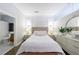 Cozy bedroom with a tufted headboard, flanked by bedside tables and lamps, creating a serene and inviting atmosphere at 560 Dutch Valley Ne Rd # 2207, Atlanta, GA 30324