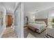 Bright bedroom featuring a stylish bed, accent rug, and a glass-enclosed upper level, offering a unique architectural element at 560 Dutch Valley Ne Rd # 2207, Atlanta, GA 30324