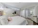 Well-appointed bedroom featuring a chic glass divider, a comfortable bed, and stylish decor, exuding modern elegance at 560 Dutch Valley Ne Rd # 2207, Atlanta, GA 30324