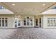Welcoming entrance with a covered walkway and stone tiles leading to the glass doors of the building at 560 Dutch Valley Ne Rd # 2207, Atlanta, GA 30324