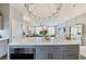 Spacious kitchen island with modern appliances and view into the elegantly furnished living room at 560 Dutch Valley Ne Rd # 2207, Atlanta, GA 30324
